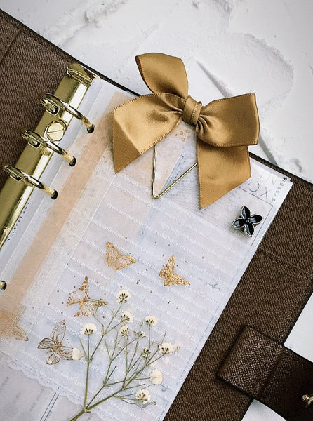 vintage gold bow deco with paper clip